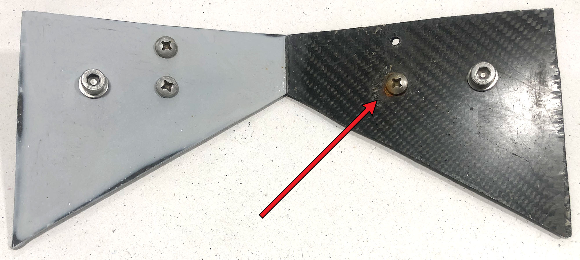 Blocking galvanic reaction between carbon fibre and stainless steel.