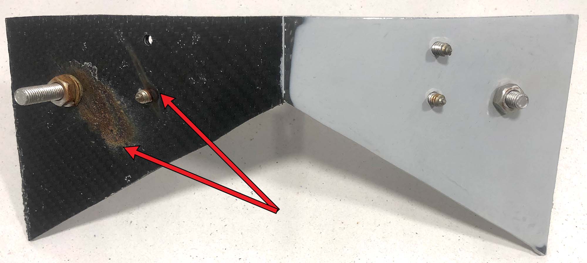 Blocking galvanic reaction between carbon fibre and stainless steel.